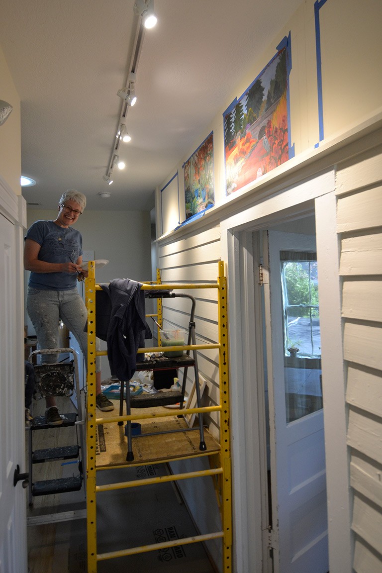 Ava Howard at work on the Shelter Alternatives mural