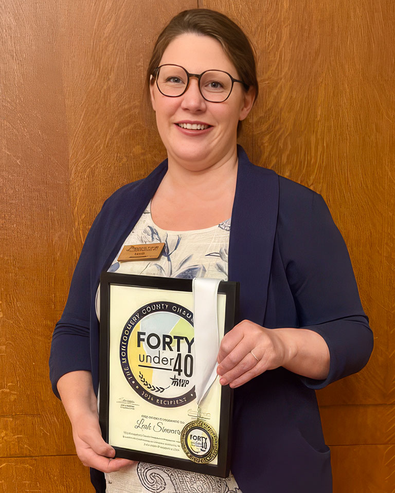 Photo of Leah Simmerman with Forty Under 40 award.
